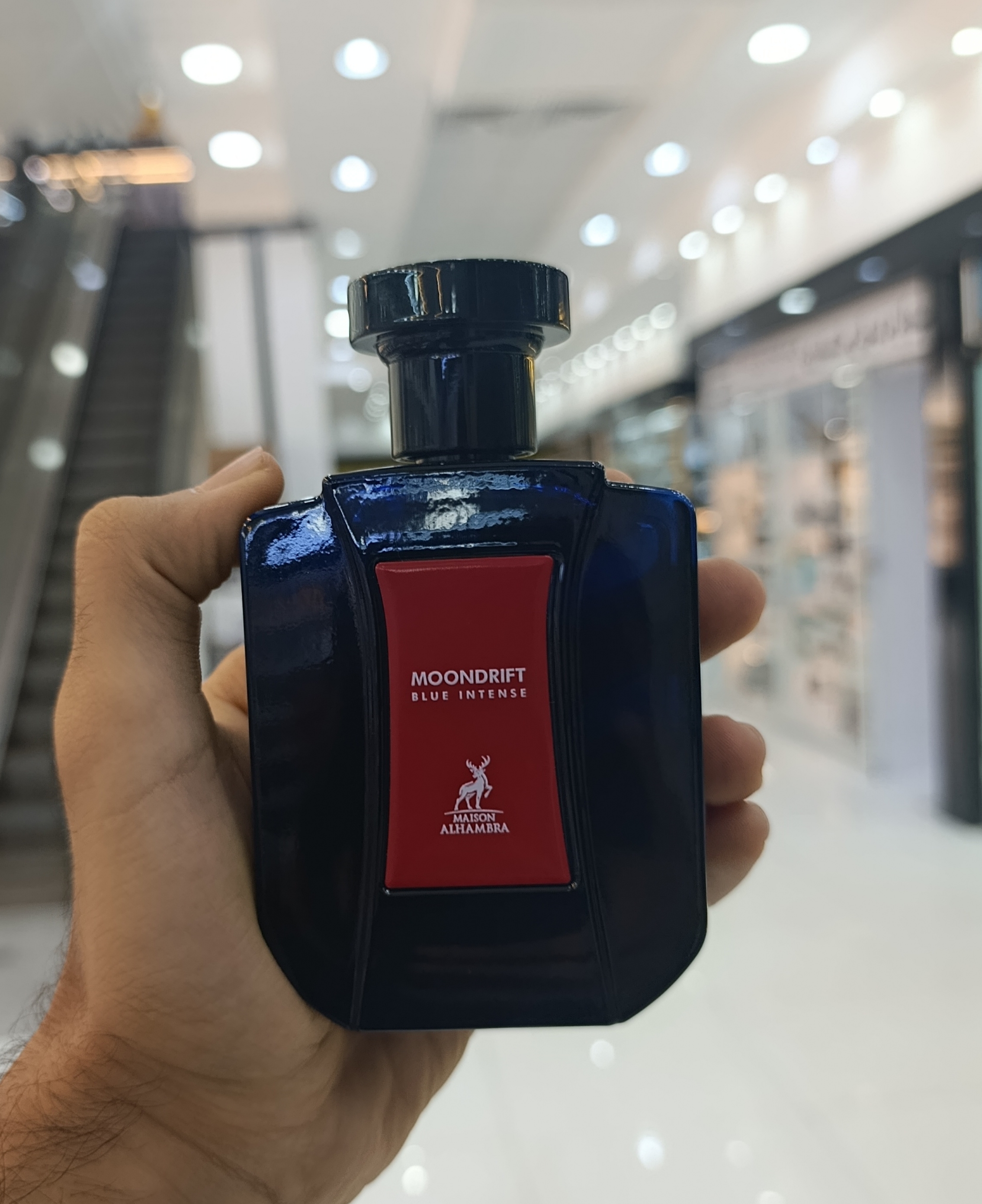 عطر ادکلن الحمبرا مون دریفت بلو اینتنس